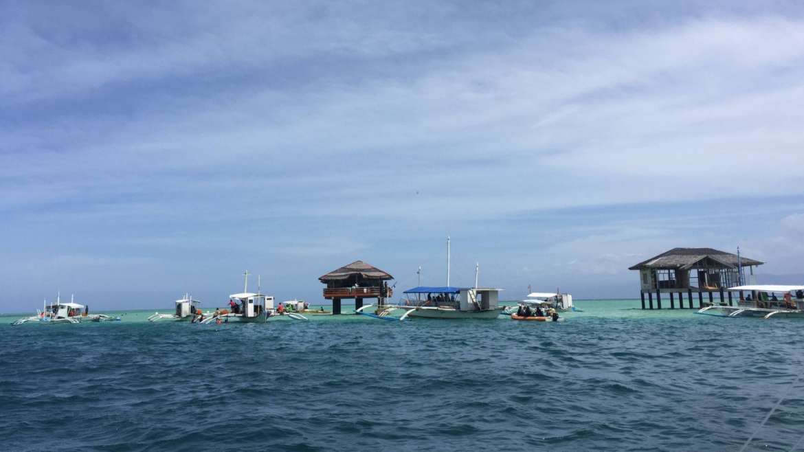 Manjuyond Sandbar- the cottages and the boats, Philippines
