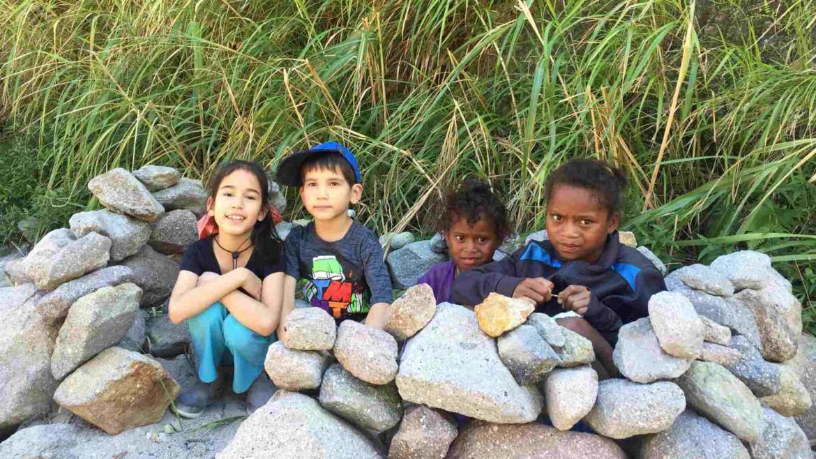 Mount Pinatubo, Philippines. Our kids playing with Aeta kids in their "stone houses".