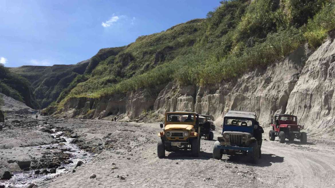 Mount Pinatubo, Philippines. Traveling on the ducty volcanic valley by 4x4 vehicles.