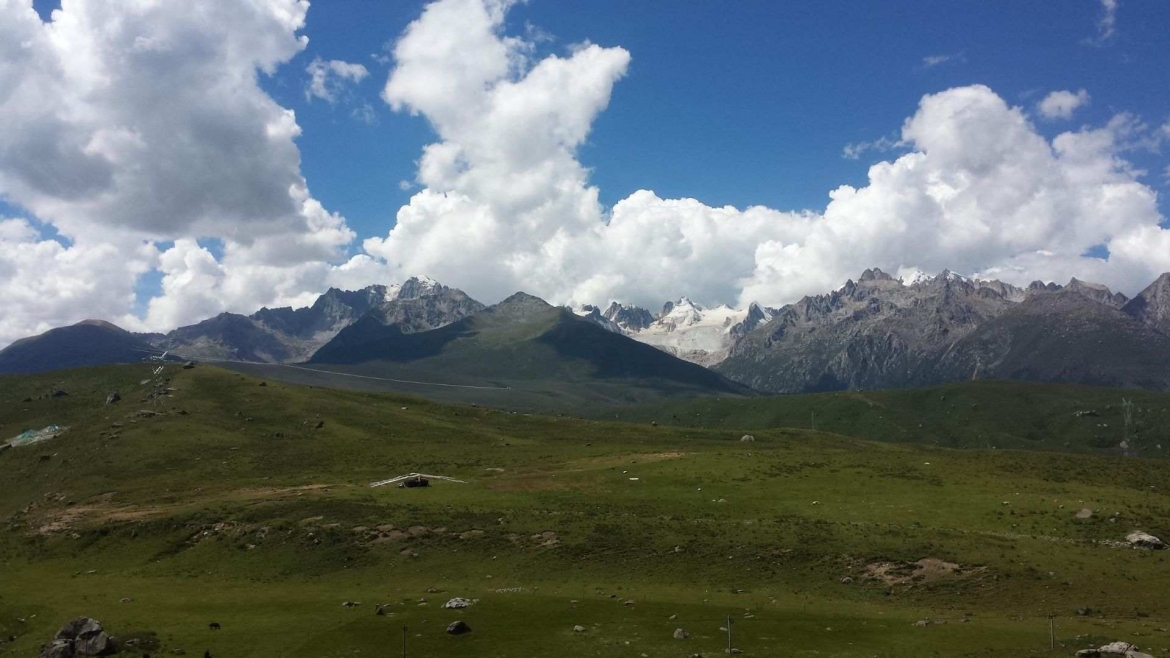 Tibetan grasslands and Chola Mountain on the background